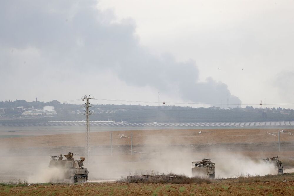 Israeli military tries to strengthen borders with Gaza as battle enters third day  / ATEF SAFADI